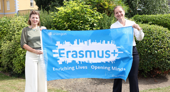 Deirdre Keaveney and Orla Gogarty of St Patrick's Mental Health Services stand outside St Patrick's University Hospital in Dublin while carrying an Erasmus+ flag.
