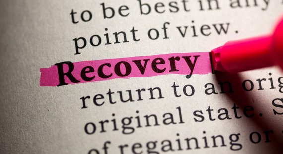 The word "recovery" is highlighted in a dictionary, with snippets of its definition of "a return to an orginal state" showing underneath.
