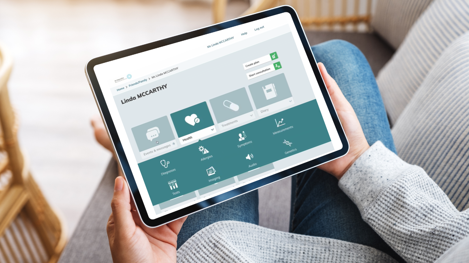 This is an image of a tablet with a mock up of the Your Portal  home page with details of a service user.