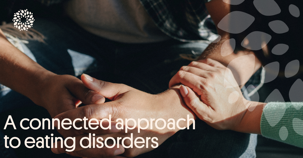 This is an image of a woman's hands offering comfort to a male but clasping their hands together.